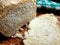 Fresh bread from the oven, halved, on a wooden cutting board, close-up photo