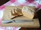 Fresh bread on a rye ferment without yeast cut on a wooden cutting board on a checkered tablecloth