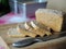 Fresh bread on a rye ferment without yeast cut on a wooden cutting board on a checkered tablecloth