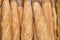 Fresh bread on the store shelf packed in cellophane, food background