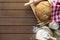 fresh bread with wheat ears and sack of flour, yeast, rolling pin on dark table, top view