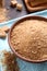 Fresh breadcrumbs in bowl on table, above view