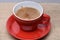 Fresh brewed coffee poured into cup with splashes and bubbles.