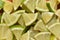 Fresh and bright sliced lime in the form of triangles