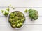 Fresh broccoli in a bowl,chopped broccoli florets on white background. closeup, top view, negative space, vegan concept,