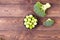 Fresh broccoli, Brussels sprouts in a bowl on a wooden table - ecological products, healthy food. Flat lay