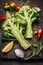 Fresh broccoli, cut into halves with ingredients for cooking, close up. Vegan food