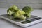 Fresh broccoli kitchen scale   a light background