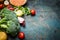 Fresh broccoli , various vegetables, red lentil and ingredients for cooking on rustic wooden background, border.