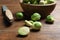 Fresh Brussels sprouts, bowl and knife on table