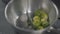 Fresh brussels sprouts in pan on cooking surface close-up. Sprouts roasted with olive oil on frying pan mixing with a