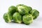 Fresh brussels sprouts on white backdrop for ads captivating packaging, visually striking