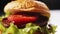 Fresh bun falls down onto hamburger on table extreme closeup