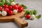 Fresh bunch of colorful radish on grey concrete background