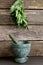 Fresh Bunch of Valerian Herb Leaves hanging above Green Marble