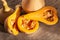 Fresh butternut squash on rustic wooden table