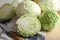 Fresh cabbages on wooden table