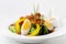 Fresh Caesar Salad with Deep-fried Bacon, Boiled Eggs & mayonnaise, Italian dressing on White Porcelain Round plate, on White
