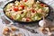 Fresh Caesar salad with shrimp and tomatoes close-up. horizontal