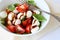 Fresh caprese salad in bowl