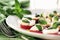 Fresh caprese salad with delicious tomatos + mozzarella and bas