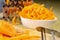 Fresh carrot grated on a metal kitchen grate. Vegetables prepared for salad with a meal on the kitchen table