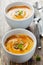 Fresh carrot soup in white bowl, dietary vegetable soup