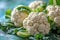 Fresh Cauliflower Heads With Green Leaves Close-Up at a Farmers Market