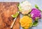 Fresh cauliflowers on rustic background.