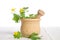 Fresh celandine in wooden mortar