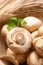 Fresh Champignon mushroom in natural basket
