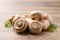 Fresh Champignon mushroom on wooden background