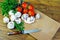 Fresh champignons and ripe tomatoes on a cutting board. Copy spaces.