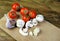 Fresh champignons and ripe tomatoes on a cutting board. Copy spaces.