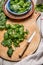 Fresh chard leaves on cutting board with old knife