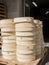 Fresh cheeses stacked on pallets