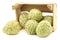 Fresh cherimoya fruits Annona cherimola in a wooden crate