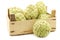 Fresh cherimoya fruits Annona cherimola in a wooden crate