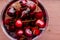 Fresh cherries dropped into water.Juicy cherries with water drops, close up. Selective focus .Copy space