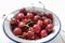 Fresh cherries with water drops in a bowl