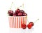 Fresh cherry berries in striped bucket