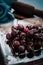 Fresh cherry on clear plate on wooden background. fresh ripe cherries. sweet cherries.