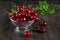 Fresh cherry in a metal sieve with mint