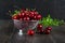 Fresh cherry in a metal sieve with mint