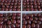 Fresh cherry, not very clean in four trays of the fruit market