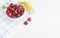 Fresh cherry on plate on wooden white background. fresh ripe cherries. sweet cherries
