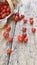 Fresh cherry tomatoes spilled on a rustic plank