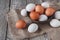 Fresh chicken brown eggs on sack, organic farming background