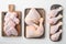 Fresh chicken meat cuts Farm poultry meat, on wooden cutting board, on white background, top view flat lay