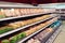 Fresh chicken meat on supermarket shelf, toned